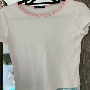 white crop top with pink cheetah around collar